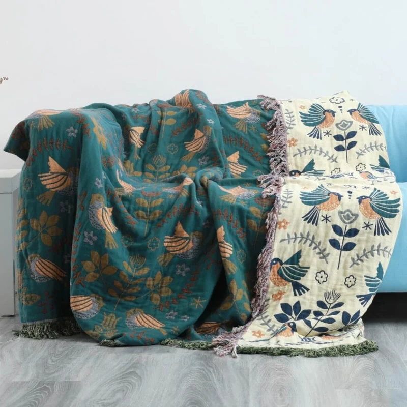 Vendbar plaid med fuglemotiv - Skandinavisk hygge til hjemmet